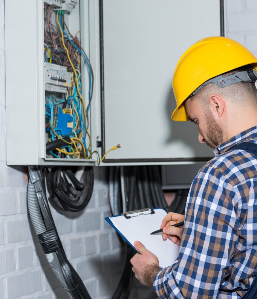 professional-electrician-inspecting-wires-in-electrical-box.jpg